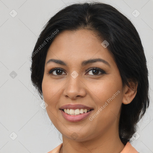 Joyful latino young-adult female with medium  brown hair and brown eyes