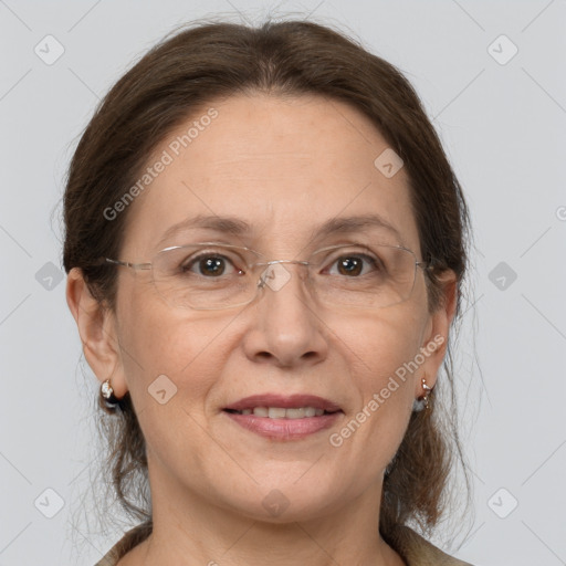 Joyful white adult female with medium  brown hair and grey eyes