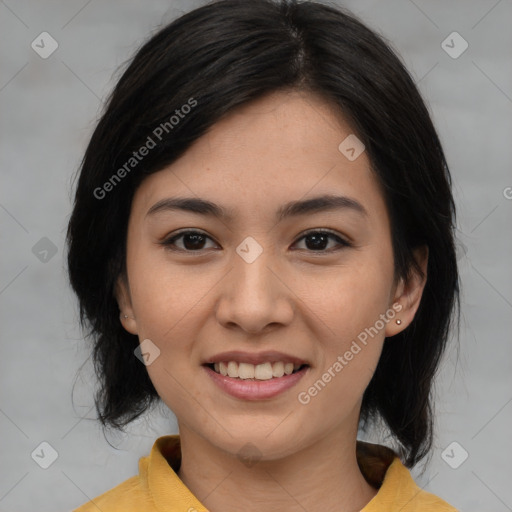 Joyful asian young-adult female with medium  black hair and brown eyes