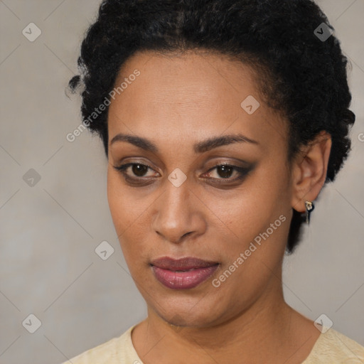 Joyful black young-adult female with short  black hair and brown eyes