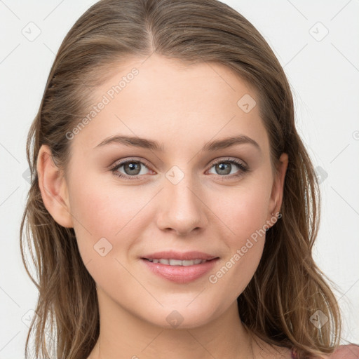 Joyful white young-adult female with long  brown hair and grey eyes