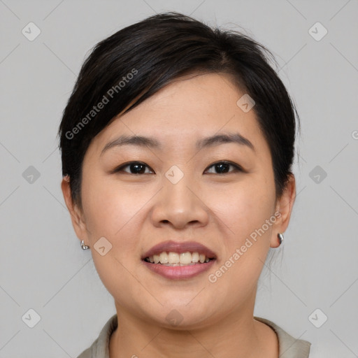 Joyful asian young-adult female with short  black hair and brown eyes