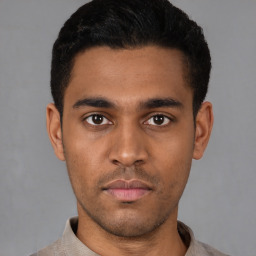 Neutral latino young-adult male with short  black hair and brown eyes