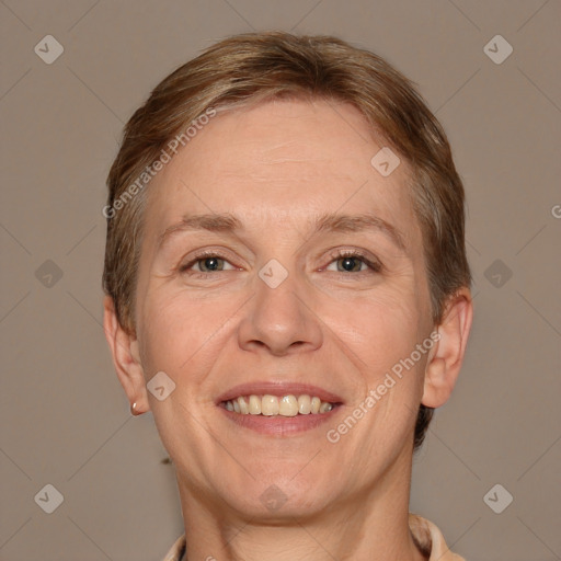 Joyful white adult female with short  brown hair and brown eyes