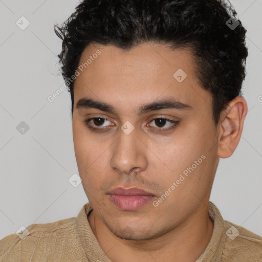 Neutral latino young-adult male with short  brown hair and brown eyes