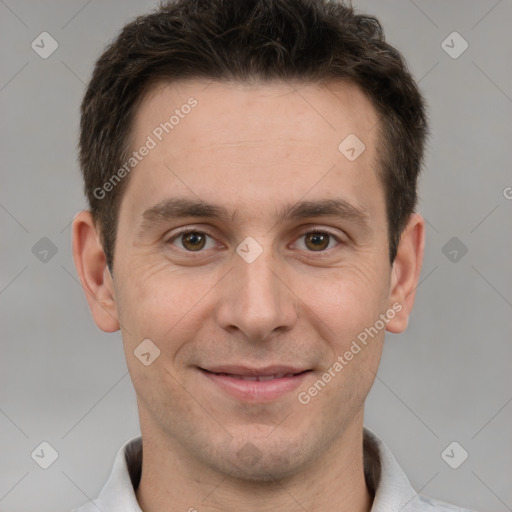 Joyful white adult male with short  brown hair and brown eyes