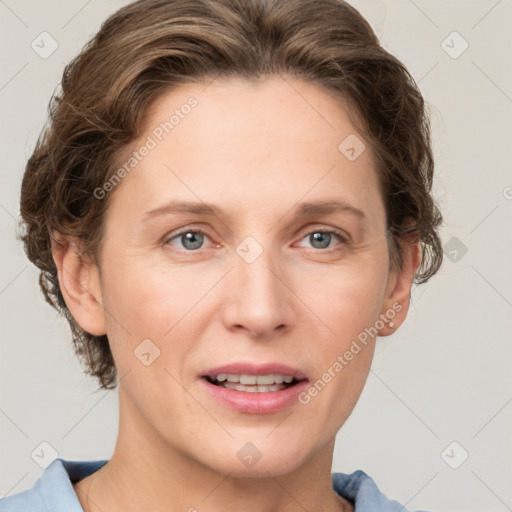 Joyful white adult female with short  brown hair and grey eyes