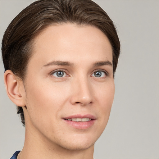 Joyful white young-adult female with short  brown hair and grey eyes