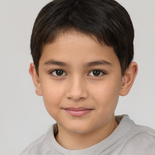 Joyful white child male with short  brown hair and brown eyes