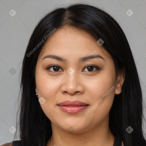 Joyful asian young-adult female with long  brown hair and brown eyes