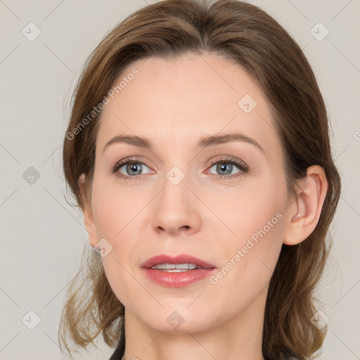 Joyful white young-adult female with medium  brown hair and blue eyes