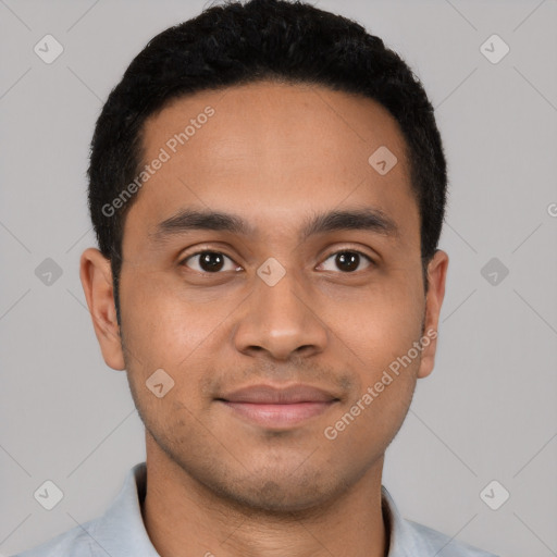 Joyful latino young-adult male with short  black hair and brown eyes