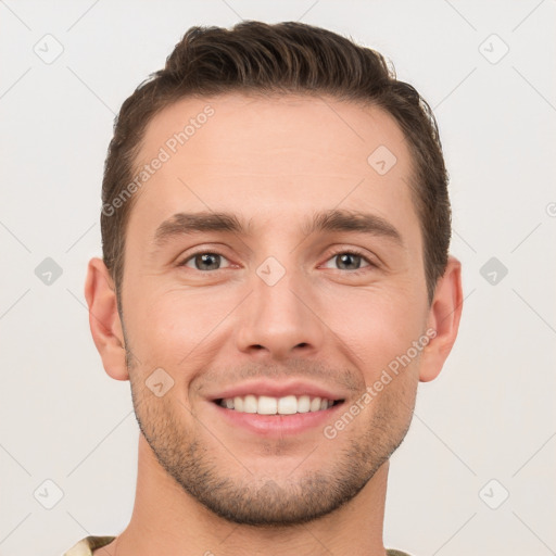 Joyful white young-adult male with short  brown hair and brown eyes