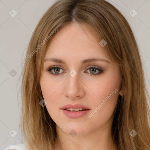 Neutral white young-adult female with long  brown hair and green eyes