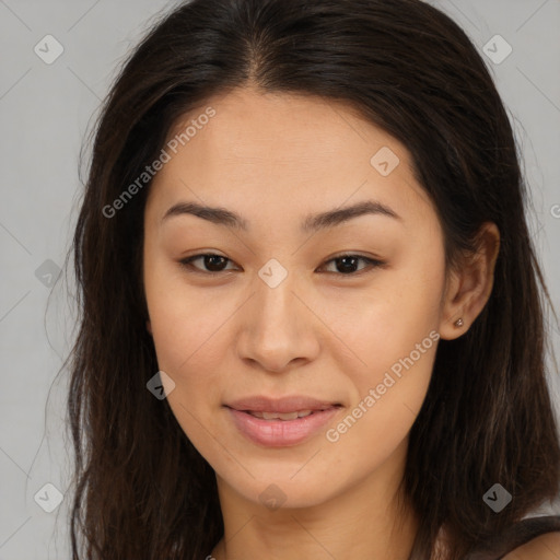 Joyful asian young-adult female with long  brown hair and brown eyes