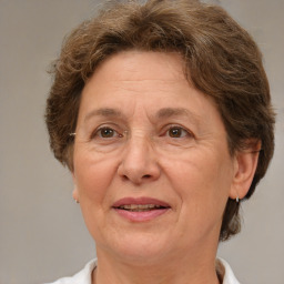 Joyful white middle-aged female with short  brown hair and brown eyes