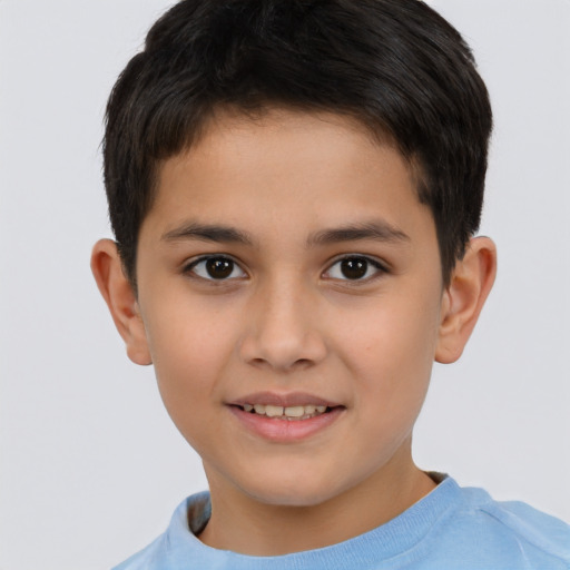 Joyful white child male with short  brown hair and brown eyes