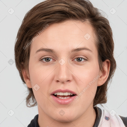 Joyful white young-adult female with medium  brown hair and grey eyes