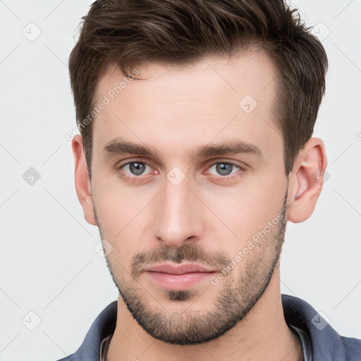 Neutral white young-adult male with short  brown hair and brown eyes