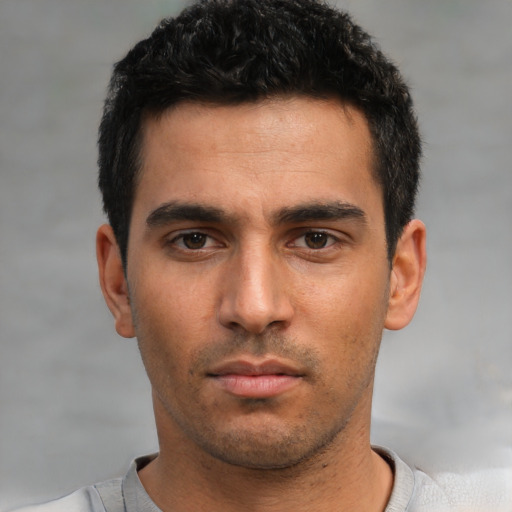 Neutral white young-adult male with short  black hair and brown eyes