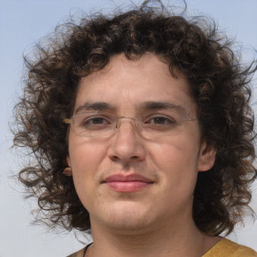 Joyful white adult male with medium  brown hair and brown eyes