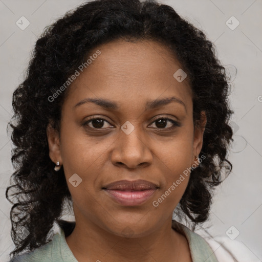 Joyful black young-adult female with medium  brown hair and brown eyes