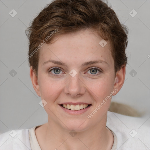 Joyful white young-adult female with short  brown hair and grey eyes