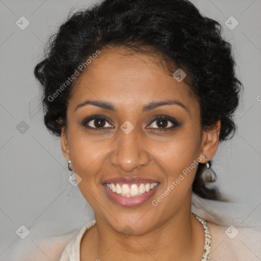 Joyful black young-adult female with long  brown hair and brown eyes