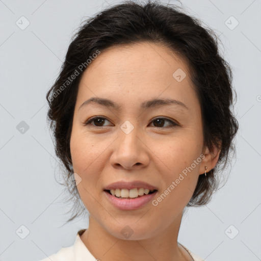 Joyful white adult female with medium  brown hair and brown eyes