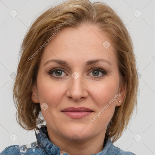 Joyful white adult female with medium  brown hair and blue eyes