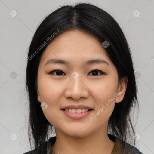 Joyful asian young-adult female with medium  black hair and brown eyes