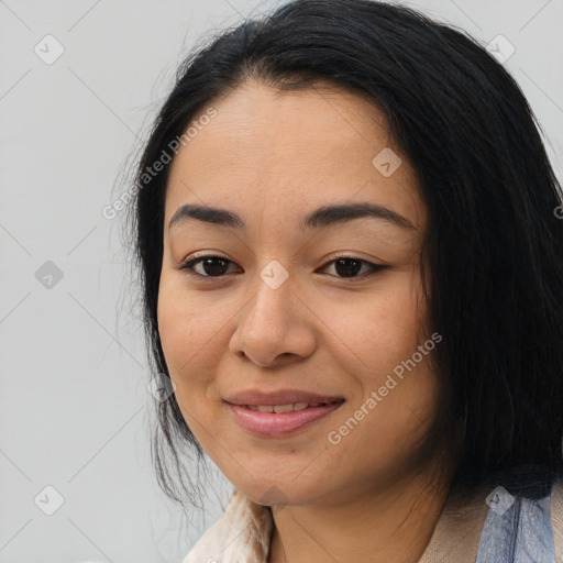 Joyful asian young-adult female with medium  black hair and brown eyes