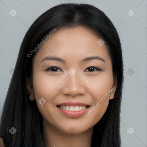 Joyful asian young-adult female with long  black hair and brown eyes