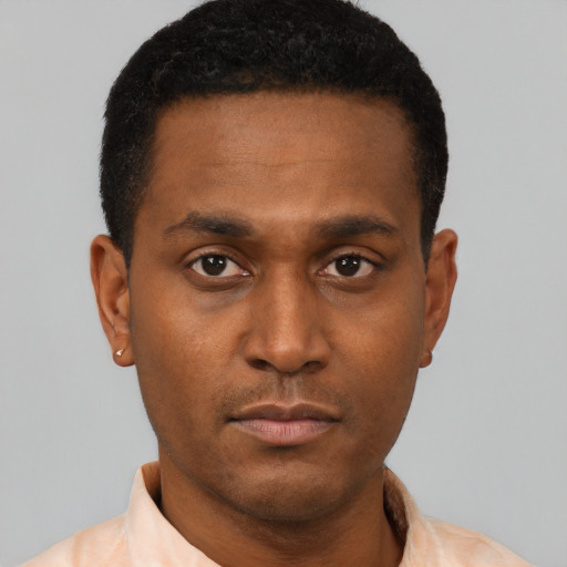 Neutral latino young-adult male with short  brown hair and brown eyes