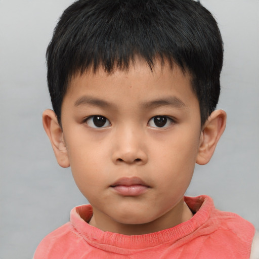 Neutral asian child male with short  brown hair and brown eyes