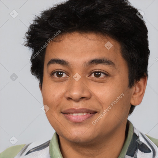 Joyful latino young-adult male with short  brown hair and brown eyes