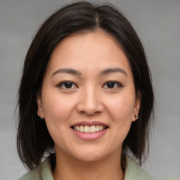 Joyful white young-adult female with medium  brown hair and brown eyes