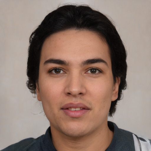 Joyful white young-adult male with medium  black hair and brown eyes