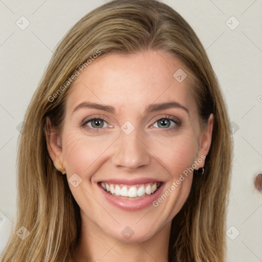 Joyful white young-adult female with long  brown hair and grey eyes