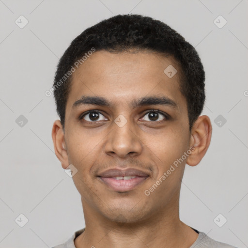 Joyful black young-adult male with short  brown hair and brown eyes