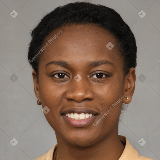 Joyful black young-adult female with short  black hair and brown eyes