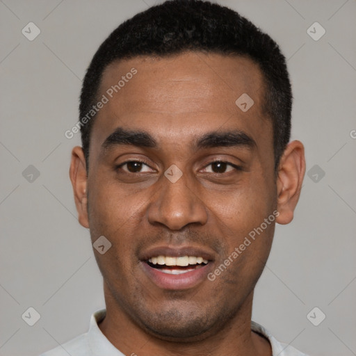 Joyful black young-adult male with short  black hair and brown eyes