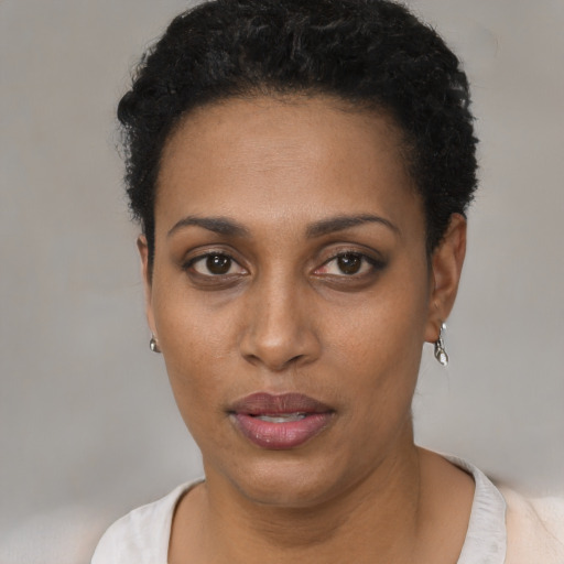 Neutral black young-adult female with short  black hair and brown eyes