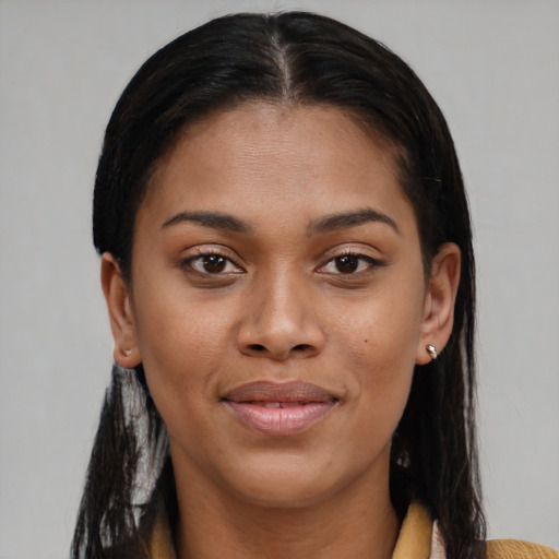 Joyful black young-adult female with medium  brown hair and brown eyes