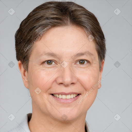 Joyful white adult female with short  brown hair and grey eyes