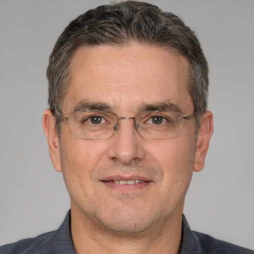 Joyful white middle-aged male with short  brown hair and brown eyes