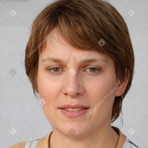 Joyful white adult female with medium  brown hair and grey eyes