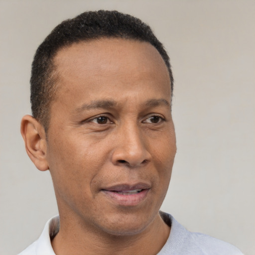 Neutral latino adult male with short  black hair and brown eyes