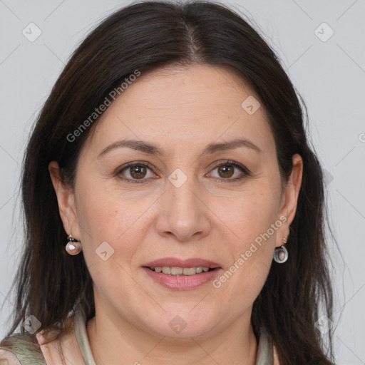 Joyful white adult female with long  brown hair and brown eyes