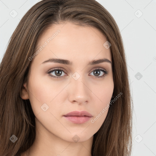 Neutral white young-adult female with long  brown hair and brown eyes